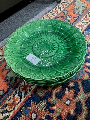 Lot 97 - SEVEN WEDGWOOD GREEN-GLAZED POTTERY FLOWERHEAD-MOULDED PLATES, LATE 19TH CENTURY