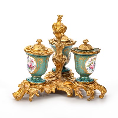 Lot 51 - A SÈVRES PORCELAIN AND ORMOLU THREE-BOTTLE INKSTAND