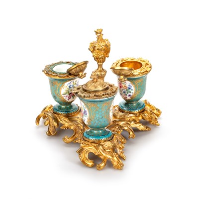 Lot 51 - A SÈVRES PORCELAIN AND ORMOLU THREE-BOTTLE INKSTAND