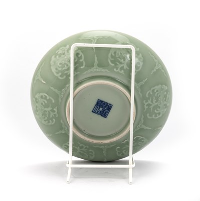 Lot 124 - A CHINESE CELADON-BACK FAMILLE ROSE DISH