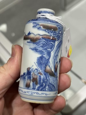 Lot 148 - A CHINESE COPPER-RED, BLUE AND WHITE PORCELAIN SNUFF BOTTLE