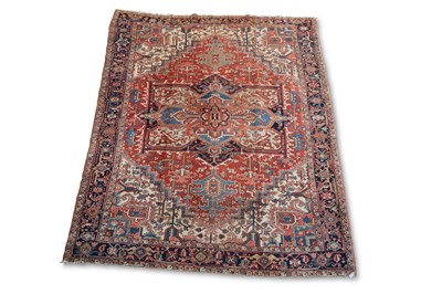 Lot 718 - AN ANTIQUE HERIZ CARPET