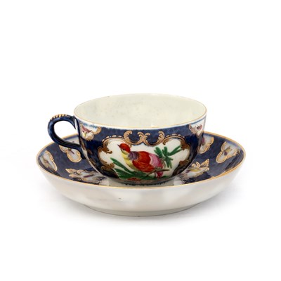 Lot 42 - A WORCESTER FACTORY-DECORATED BLUE SCALE CUP AND SAUCER, CIRCA 1770