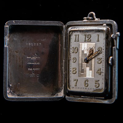 Lot 570 - A CONTINENTAL SILVER EBEL PURSE WATCH WITH CHAIN