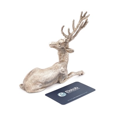 Lot 407 - AN ELIZABETH II CAST SILVER MODEL OF A RECUMBENT STAG