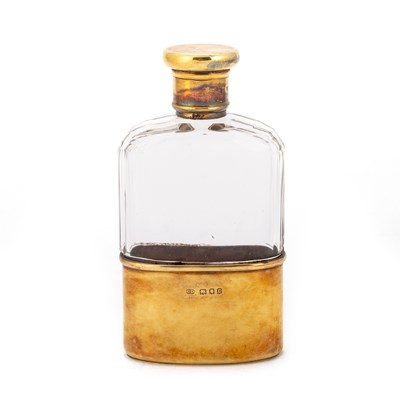 Lot 447 - A GEORGE V SILVER GILT-MOUNTED CUT-GLASS SPIRIT FLASK