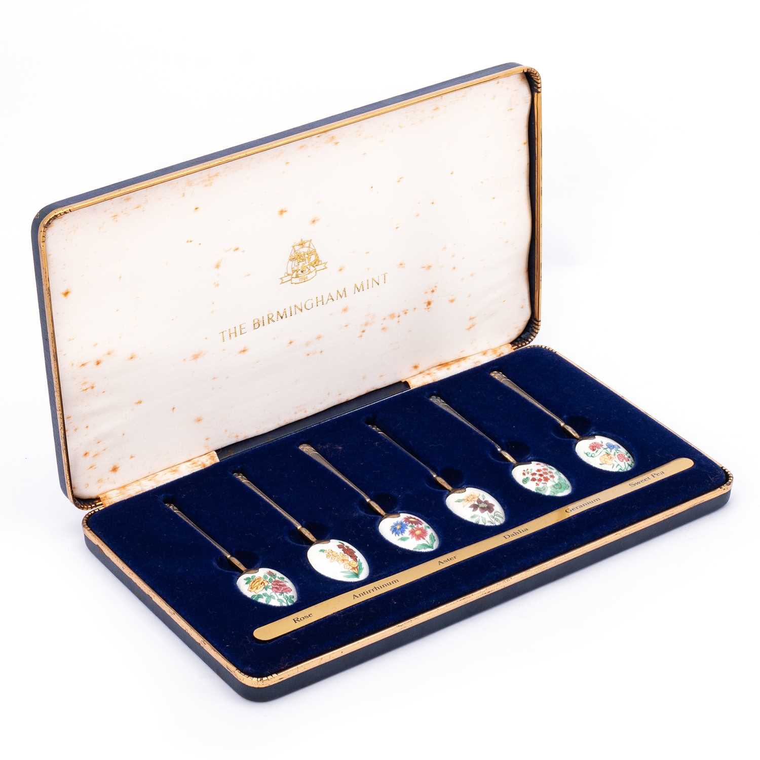 Lot 404 - A SET OF SIX ELIZABETH II SILVER AND ENAMEL 'FLOWER' SPOONS
