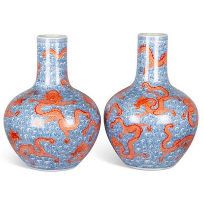 Lot 100 - A LARGE PAIR OF CHINESE UNDERGLAZE BLUE AND IRON-RED DRAGON VASES, TIANQIUPING