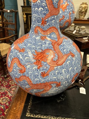 Lot 100 - A LARGE PAIR OF CHINESE UNDERGLAZE BLUE AND IRON-RED DRAGON VASES, TIANQIUPING