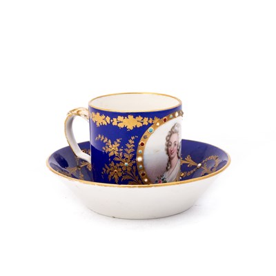 Lot 53 - A SÈVRES STYLE 'JEWELLED' CABINET CUP AND SAUCER, CIRCA 1870