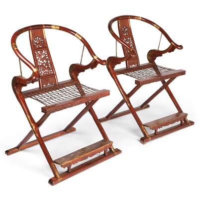 Lot 754 - A PAIR OF CHINESE BRASS-MOUNTED HARDWOOD FOLDING CHAIRS