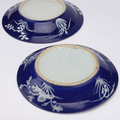 Lot 109 - A PAIR OF CHINESE REVERSE SLIP-DECORATED BLUE AND WHITE DISHES, PROBABLY 19TH CENTURY