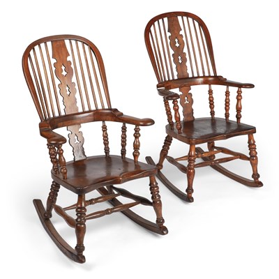 Lot 807 - A PAIR OF 19TH CENTURY ELM AND OAK LADIES AND GENTLEMENS BROAD-ARM WINDSOR ROCKING CHAIRS