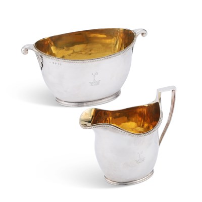 Lot 524 - A GEORGE III SILVER CREAM JUG AND SUGAR BOWL