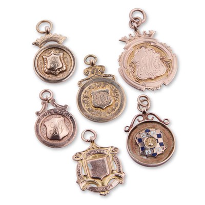 Lot 647 - SIX 9 CARAT GOLD FOBS/ MEDALLIONS