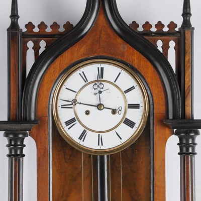 Lot 739 - A 19TH CENTURY WALNUT AND EBONISED TWO-WEIGHT VIENNA WALL CLOCK