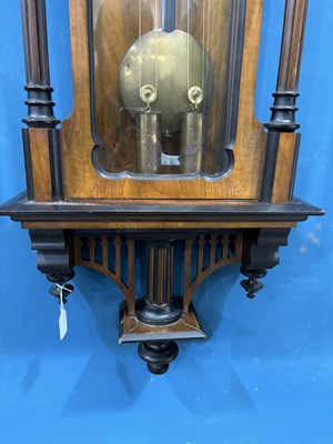 Lot 739 - A 19TH CENTURY WALNUT AND EBONISED TWO-WEIGHT VIENNA WALL CLOCK