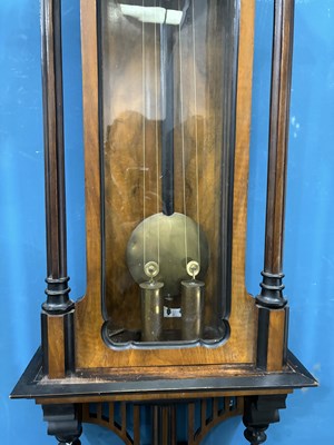 Lot 739 - A 19TH CENTURY WALNUT AND EBONISED TWO-WEIGHT VIENNA WALL CLOCK