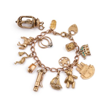 Lot 515 - A 9 CARAT GOLD CHARM BRACELET