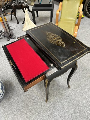 Lot 734 - A NAPOLEON III BRASS-INLAID EBONISED LADIES DRESSING TABLE-CUM-GAMES TABLE