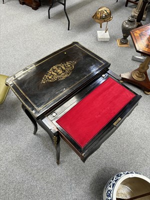 Lot 734 - A NAPOLEON III BRASS-INLAID EBONISED LADIES DRESSING TABLE-CUM-GAMES TABLE