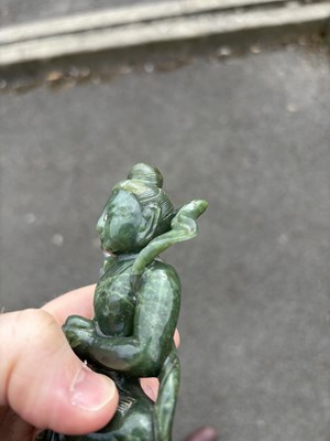 Lot 143 - A CHINESE SPINACH JADE FIGURE OF A BODHISATTVA