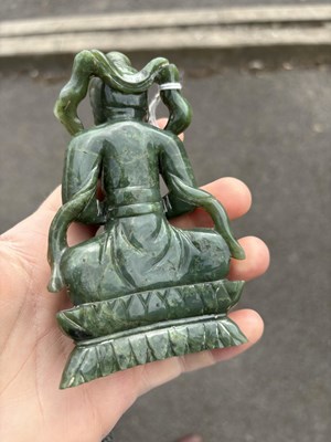 Lot 143 - A CHINESE SPINACH JADE FIGURE OF A BODHISATTVA