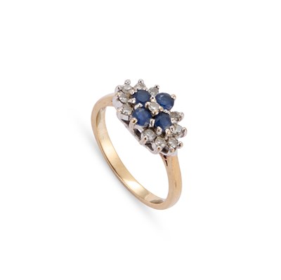 Lot 516 - A 9 CARAT GOLD DIAMOND AND SAPPHIRE CLUSTER RING