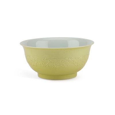 Lot 123 - A CHINESE MOULDED YELLOW-BACKED FAMILLE ROSE BOWL