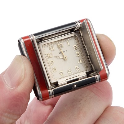 Lot 497 - CARTIER: AN ART DECO SILVER AND ENAMEL PURSE WATCH