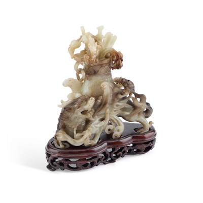 Lot 114 - A CHINESE BLACK AND WHITE JADE 'MYTHICAL BEAST' VASE AND COVER