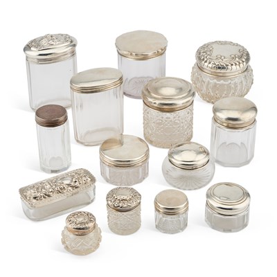 Lot 398 - A COLLECTION OF SILVER-TOPPED GLASS JARS