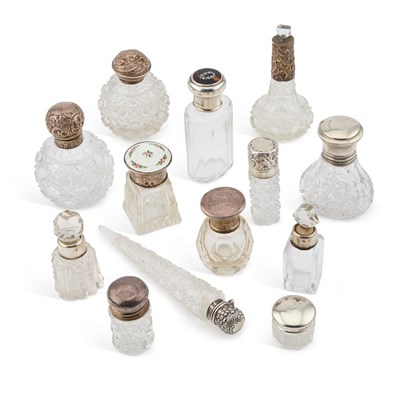 Lot 333 - A GROUP OF SILVER-MOUNTED GLASS SCENT BOTTLES AND JARS