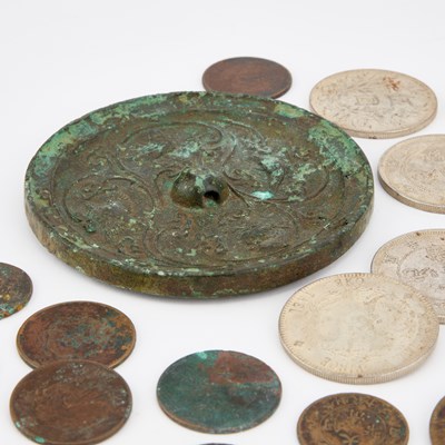 Lot 761 - A CHINESE BRONZE MIRROR AND A GROUP OF CHINESE COINS AND TOKENS