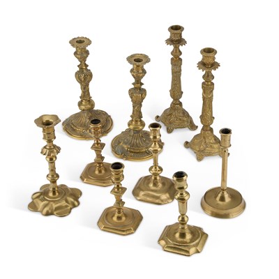 Lot 551 - A COLLECTION OF 18TH CENTURY AND LATER BRASS CANDLESTICKS