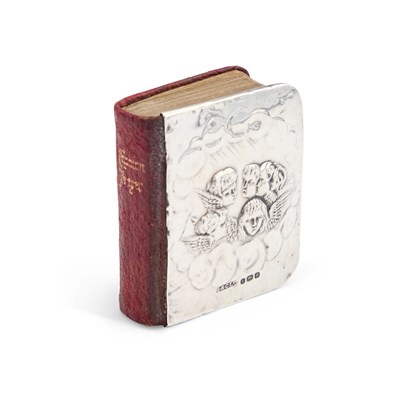 Lot 393 - AN EDWARDIAN SILVER-MOUNTED MINIATURE PRAYER BOOK