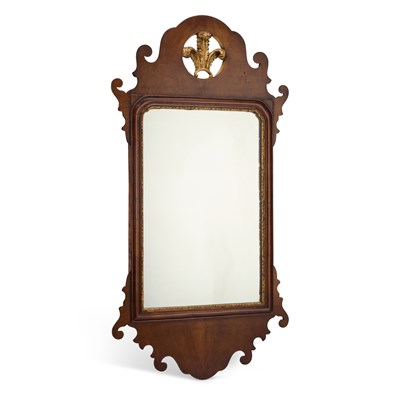 Lot 1162 - A GEORGIAN STYLE WALNUT FRETWORK MIRROR