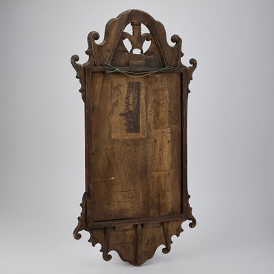 Lot 1162 - A GEORGIAN STYLE WALNUT FRETWORK MIRROR