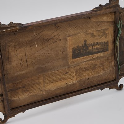 Lot 1162 - A GEORGIAN STYLE WALNUT FRETWORK MIRROR
