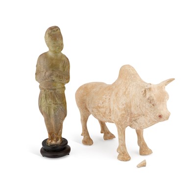 Lot 694 - A STRAW-GLAZED FIGURE AND A POTTERY MODEL OF AN OX