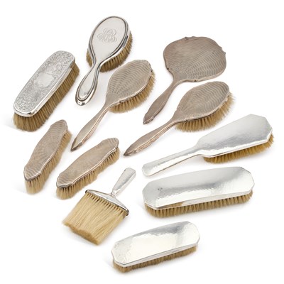 Lot 202 - A COLLECTION OF AMERICAN AND ENGLISH SILVER-MOUNTED DRESSING TABLE BRUSHES AND MIRROR