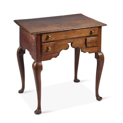 Lot 1150 - A GEORGE III OAK LOWBOY