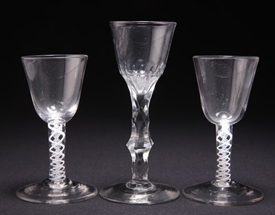 Lot 14 - TWO 18TH CENTURY OPAQUE TWIST SMALL WINE GLASSES AND A FACETED STEM WINE GLASS