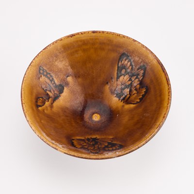 Lot 136 - A CHINESE STONEWARE 'BUTTERFLY' BOWL