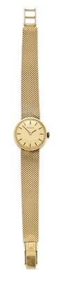 Lot 1485 - A 14 CARAT GOLD TISSOT BRACELET WATCH