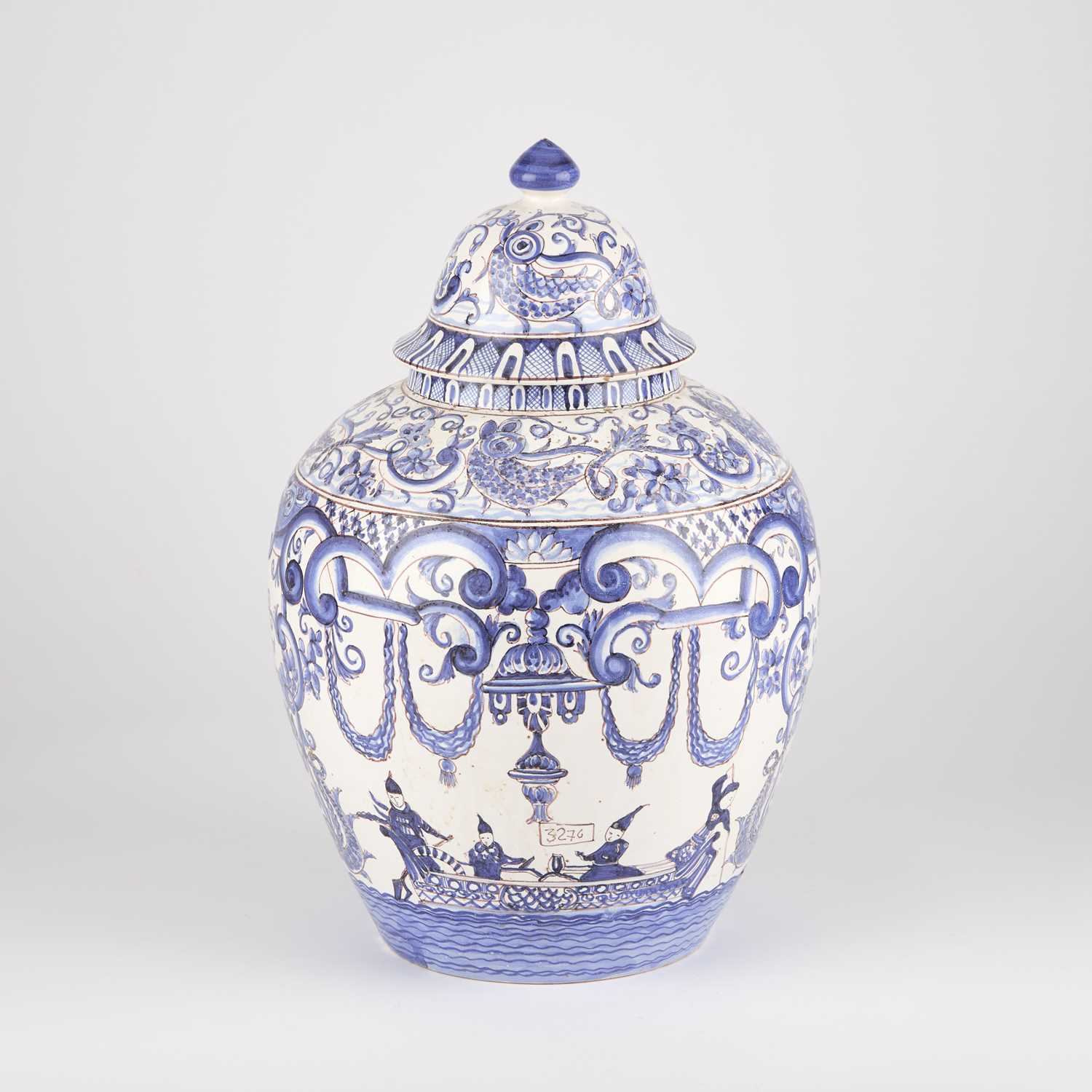 Lot 356 - A CONTINENTAL BLUE AND WHITE FAIENCE JAR AND COVER