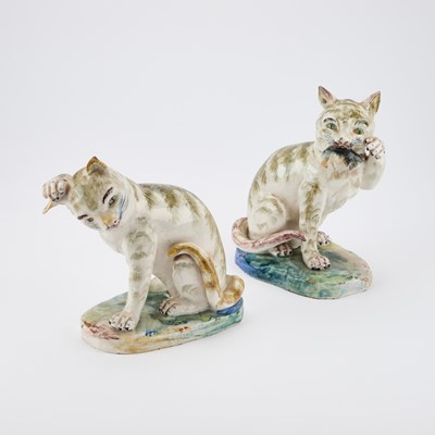 Lot 179 - A PAIR OF CONTINENTAL FAIENCE MODELS OF CATS