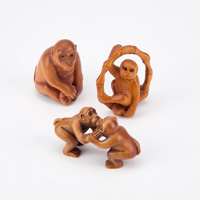 Lot 449 - THREE CARVED WOOD MONKEY NETSUKES