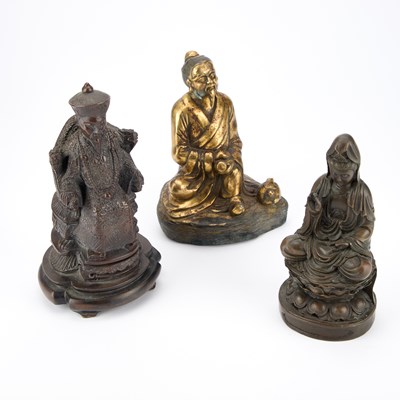 Lot 655 - A GILT-METAL BUDDHA AND TWO BRONZED FIGURES