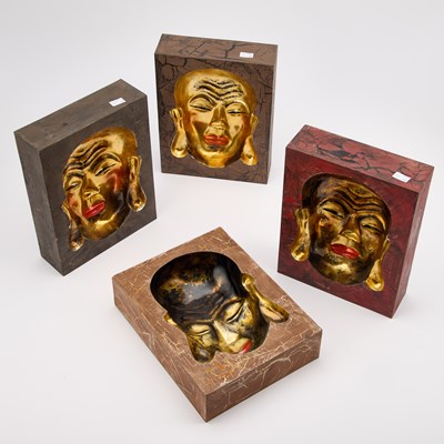 Lot 854 - FOUR ORIENTAL CONCAVE MASK PLAQUES